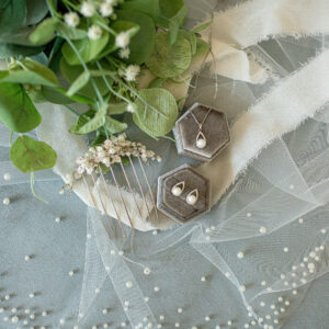 Set of pearl bridal earrings and matching necklace and hair comb from Satin & Lace in Riverview, FL.