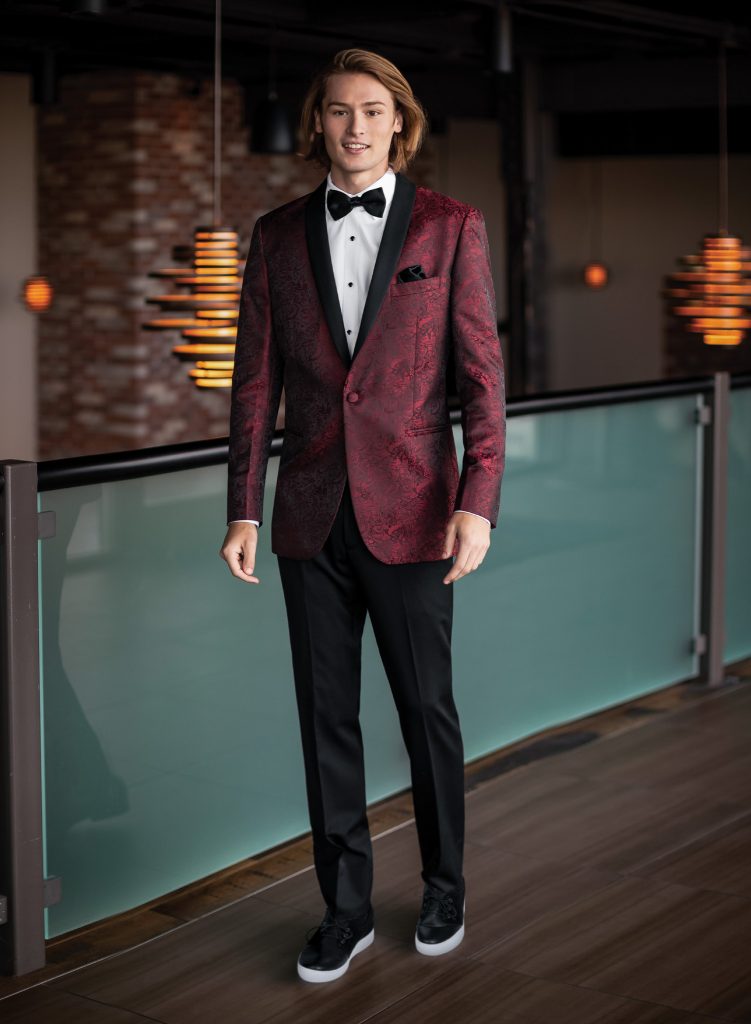 Teen boys wearing a sharp suit for prom or homecoming, rented from Satin and Lace Bridal Boutique in Riverview, FL, showcasing formal menswear style perfect for Tampa Bay events.