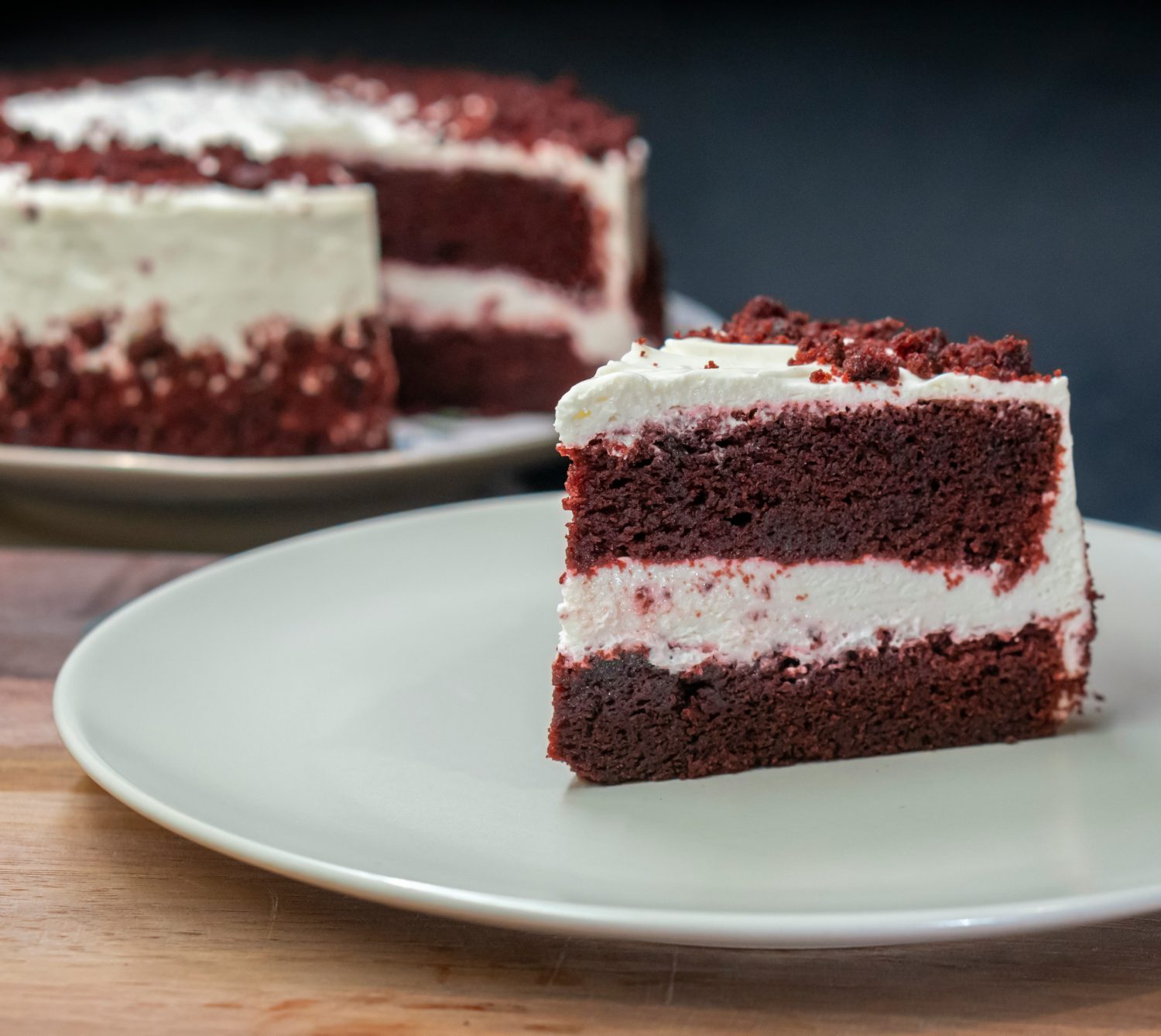 Decadent red velvet wedding cake with cream cheese frosting, elegantly displayed for a romantic Valentine’s-themed wedding in Riverview, FL. A perfect dessert choice for couples seeking a luxurious and bold wedding aesthetic. Captured by Amirali Mirhashemian via Unsplash.